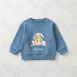 Blue children's sweatshirt with a bunny design and 'Evie-Rose' text on a textured white background.