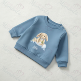 Blue children's sweatshirt with a bunny design and name 'Alfie' on a light gray background.