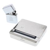 Silver lighter and case with engraved text on a white background