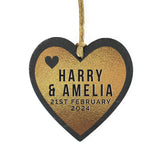 Heart-shaped slate ornament with 'Harry & Amelia' and date on a white background