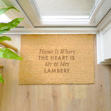 Doormat with personalized text on a wooden floor