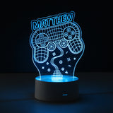 3D LED lamp with 'MATTHEW' and gaming controller design on a black background