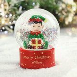 Personalized Christmas snow globe with an elf holding a gift, set against a festive background.