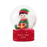 Christmas snow globe with a character holding a gift, on a white background