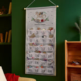 Advent calendar with decorative elements on a green wall