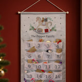 Advent calendar with rocking horse design and numbered pockets against a red background