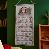 Christmas-themed advent calendar with Santa Claus and reindeer design on a green wall.