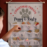 Dog-themed Christmas treats calendar for Poppy & Rusty with paw print design.