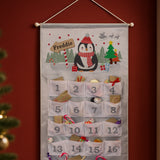 Advent calendar with penguin design and numbered pockets on a red wall.