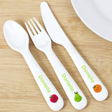 A set of white plastic cutlery including a spoon, fork, and knife, each with the name 'Danielle' and fruit illustrations on the handles.