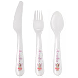 Set of white cutlery with 'Amelia' and fairy design on handles against a white background