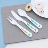 Personalized cutlery set with 'Annabel' on a wooden surface