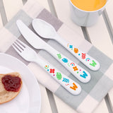 A set of plastic cutlery for kids, featuring colourful shapes and the letter 'W' on a grey and white checked linen napkin. The set includes a fork, knife, and spoon.