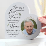 A personalised heart-shaped wooden ornament with a photo and text personalization example showing a man's portrait and the text 'Because someone we Love is in Heaven, there's a little bit of Heaven in our Home' followed by the name David Evans and a personalised message and date