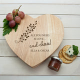 Personalised Wooden Heart Shaped Cheeseboard with delicate leaf design. Perfect gift for couples.