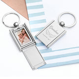 A personalised silver keyring with a photo frame design, engraved with 'Guardian Angel' and a small picture of an angel's wings.