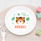 A personalised kids' plastic plate with a jungle animal design, featuring a tiger, and the name 'Anna' printed on it.