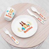 Personalised Kids Spring Bunny Dining Set, featuring a plate, cup, knife, fork and spoon. All in white plastic with bunny design and featuring the name "Matlida"