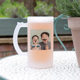A frosted beer stein with a photo and message insertion option, placed on a table outdoors.